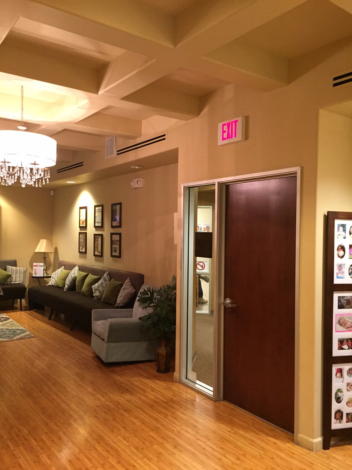 MomDoc Midwives San Tan Valley living-room with grey sofa and chandelier