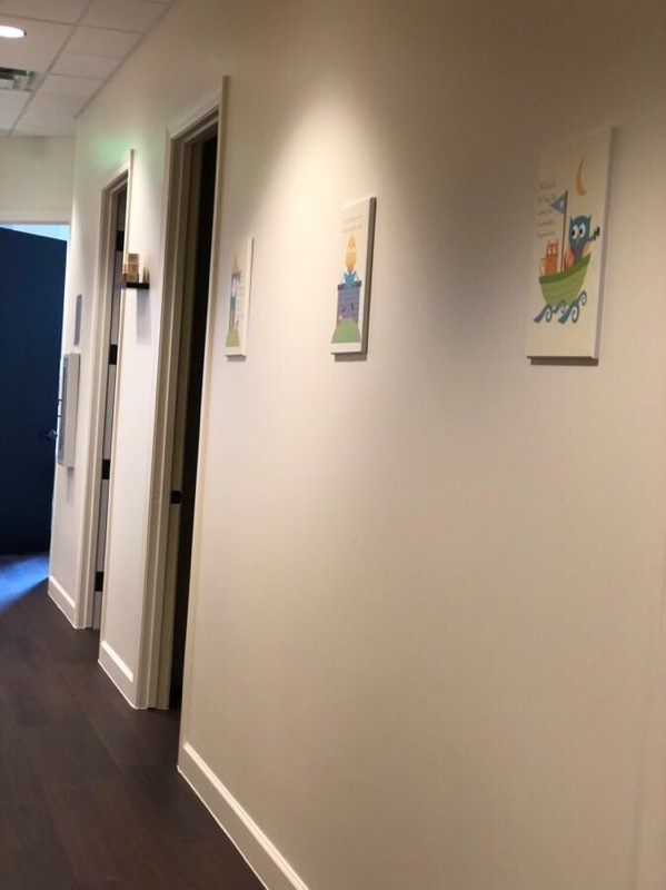 MomDoc Midwives Tolleson office hallway with colorful playful children's artwork